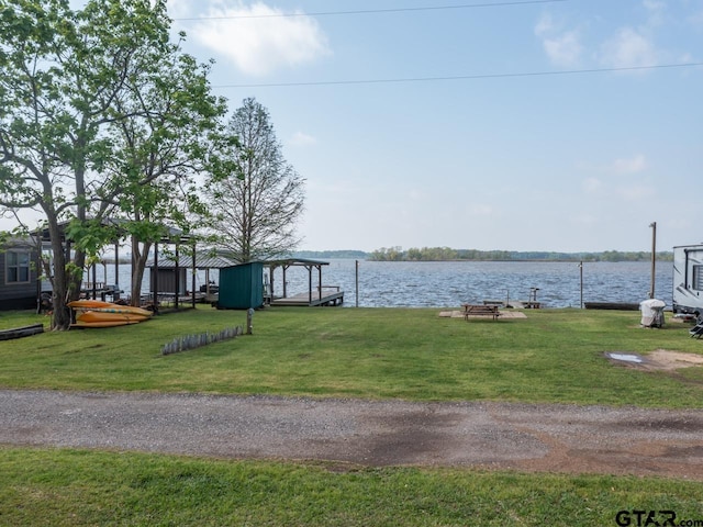 22090 Sportsmans Dr, Chandler, TX 75758 - dock area with a lawn and a water view