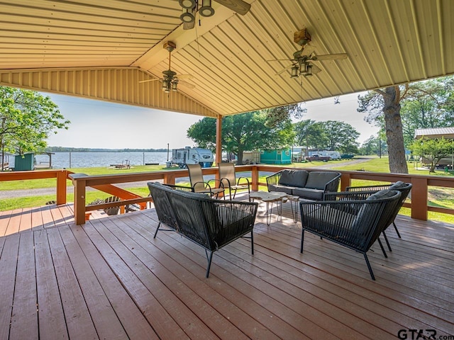 22090 Sportsmans Dr, Chandler, TX 75758 - wooden deck featuring a water view, ceiling fan, and an outdoor living space