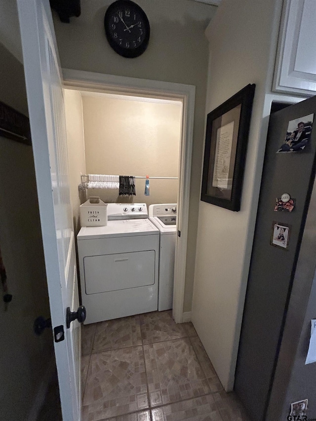 washroom with washer and clothes dryer