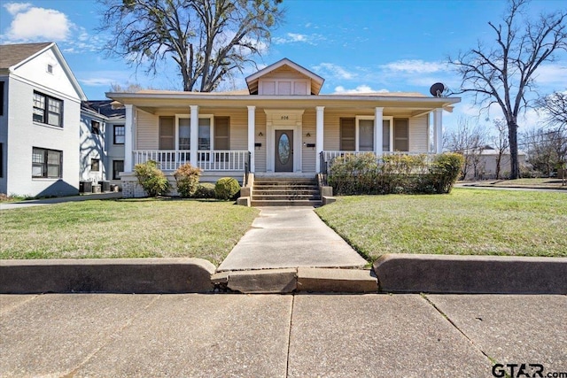 bungalow-style house with a front yard and covered porch