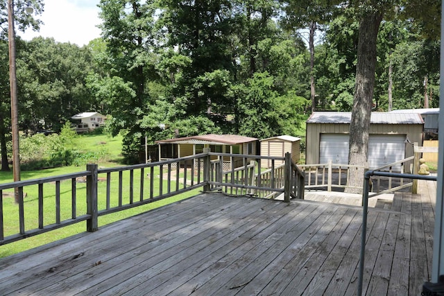 deck featuring a shed, a garage, and a yard