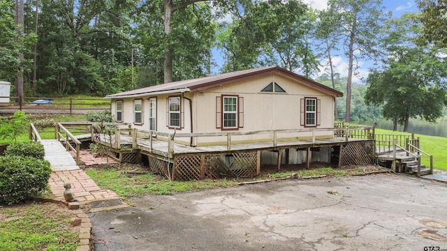 view of front of house featuring a wooden deck