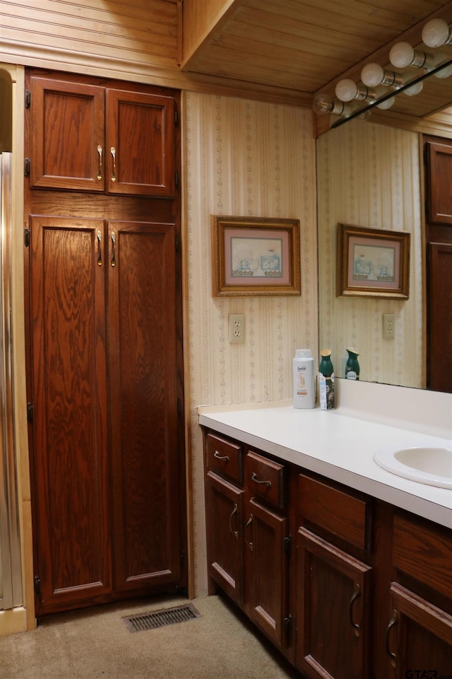 bathroom with vanity and wooden ceiling