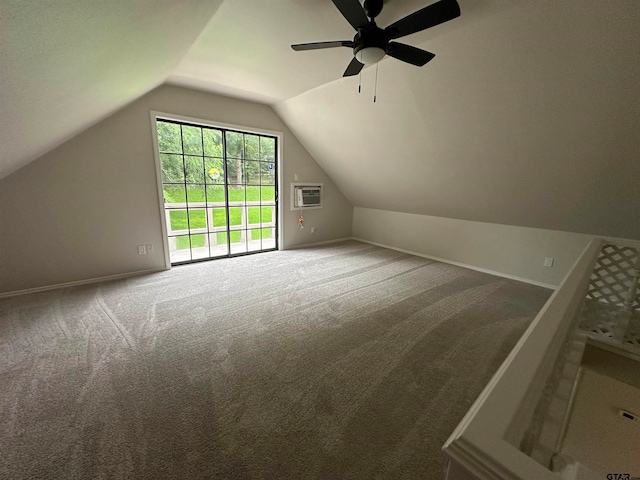 bonus room with carpet floors, ceiling fan, vaulted ceiling, and heating unit