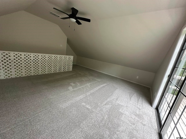 bonus room with vaulted ceiling, carpet flooring, and ceiling fan