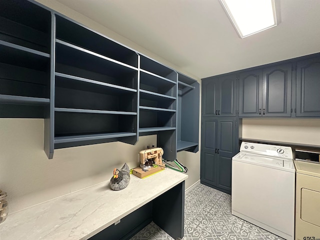 washroom featuring cabinets and washing machine and dryer