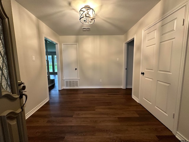 entrance foyer featuring dark hardwood / wood-style floors