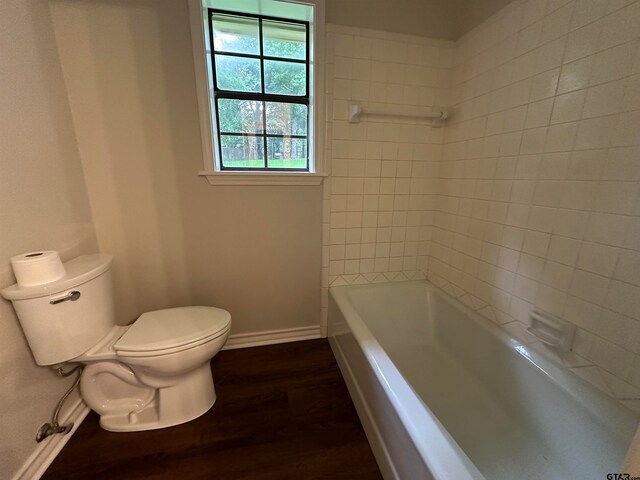 bathroom featuring hardwood / wood-style floors and toilet