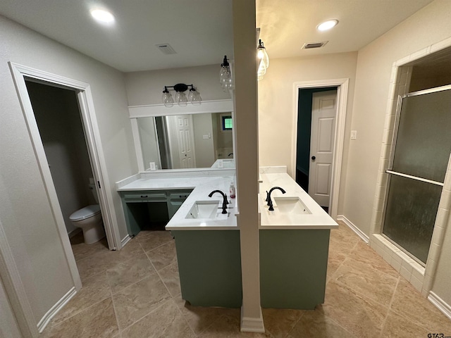 bathroom with walk in shower, vanity, and toilet