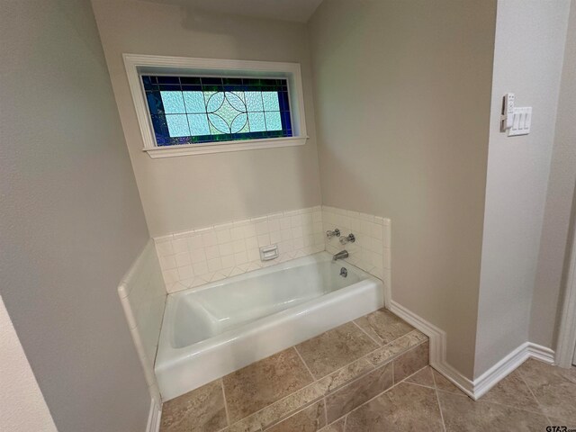 bathroom featuring a washtub
