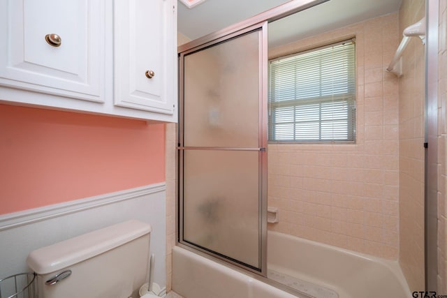 full bathroom featuring toilet and enclosed tub / shower combo