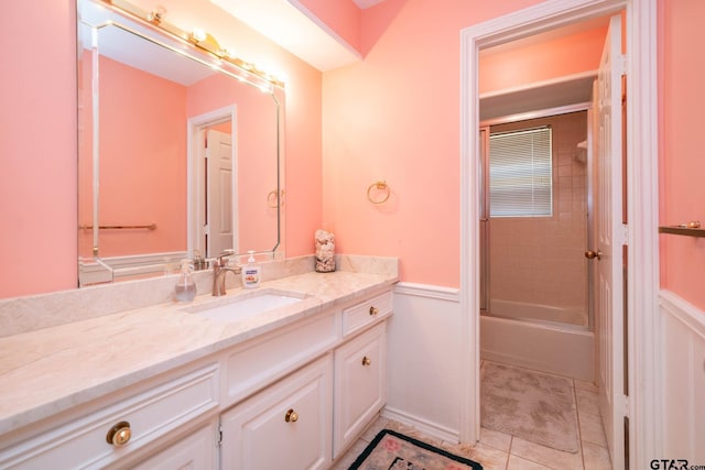 bathroom featuring  shower combination, tile patterned floors, and vanity