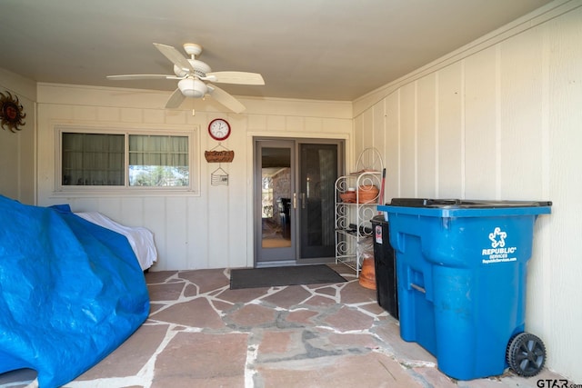 doorway to property with ceiling fan