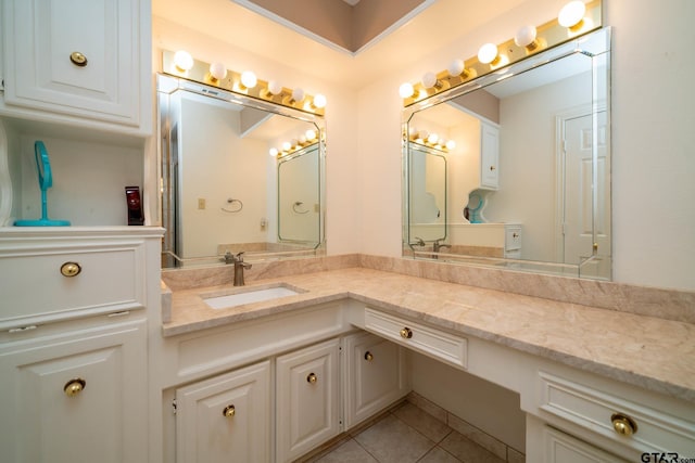 bathroom with tile patterned flooring and vanity