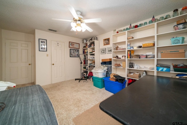 storage area featuring visible vents and ceiling fan