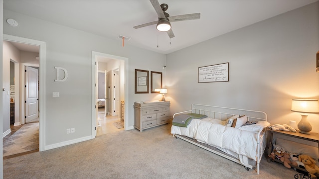 bedroom with baseboards, light colored carpet, ceiling fan, and visible vents