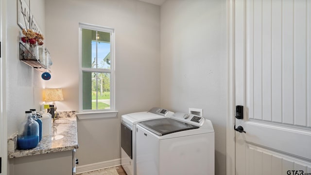laundry room featuring independent washer and dryer, laundry area, and baseboards