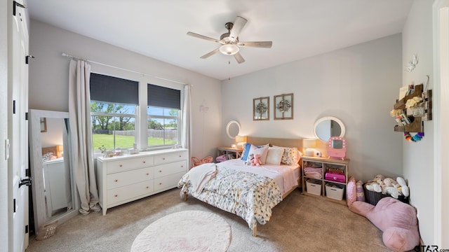 bedroom featuring a ceiling fan and light colored carpet