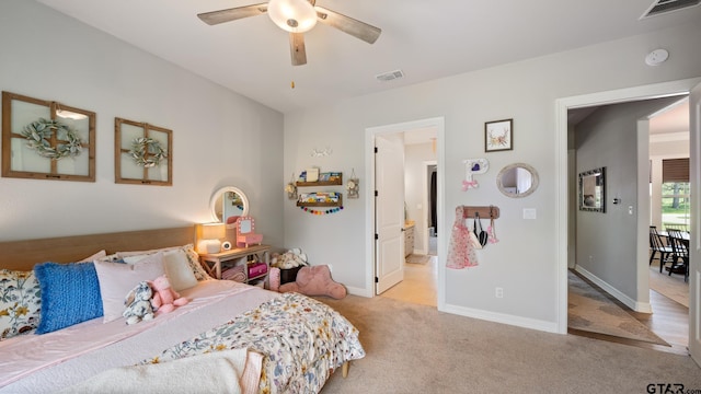 bedroom with baseboards, carpet, a ceiling fan, and visible vents