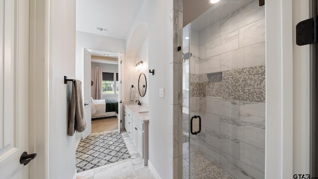 full bath featuring visible vents, connected bathroom, vanity, and a shower stall