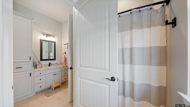 full bathroom with vanity, tile patterned flooring, and a shower with shower curtain