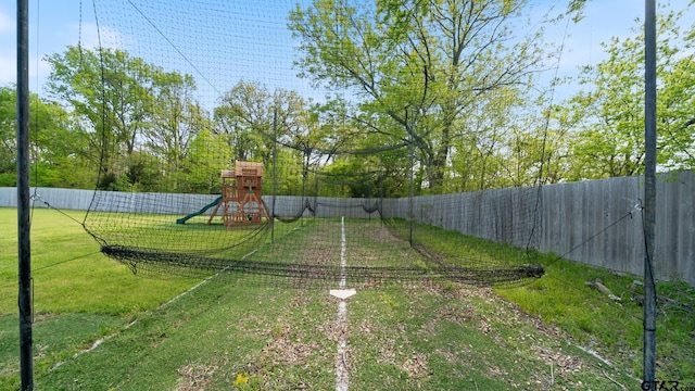 view of yard with a playground and fence