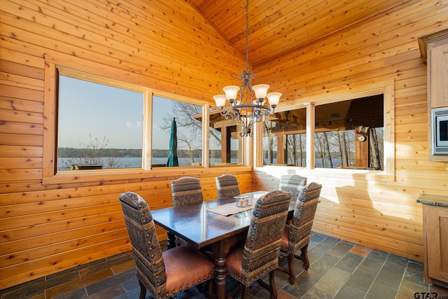 1584 Charlya Dr, Scroggins, TX 75480 - dining room with wooden walls, a chandelier, stone tile flooring, wood ceiling, and high vaulted ceiling