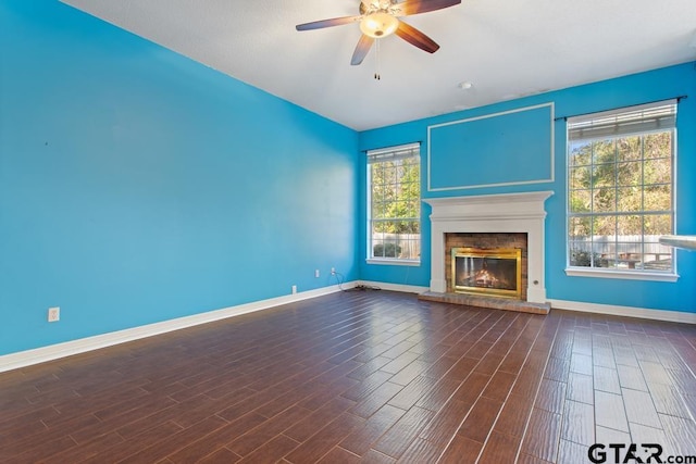 unfurnished living room featuring ceiling fan and wood-type flooring