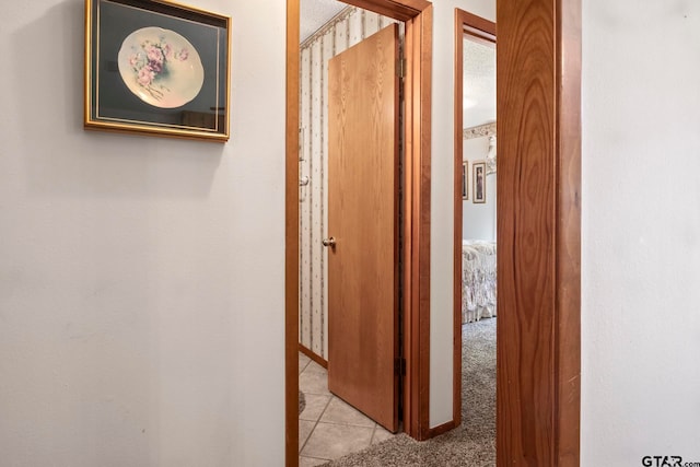 corridor featuring light tile patterned flooring