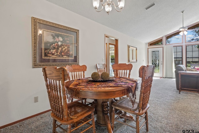 dining area with ceiling fan with notable chandelier, carpet floors, a textured ceiling, and vaulted ceiling