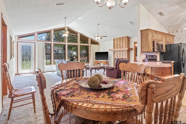 dining area featuring a textured ceiling, high vaulted ceiling, ceiling fan with notable chandelier, and light carpet