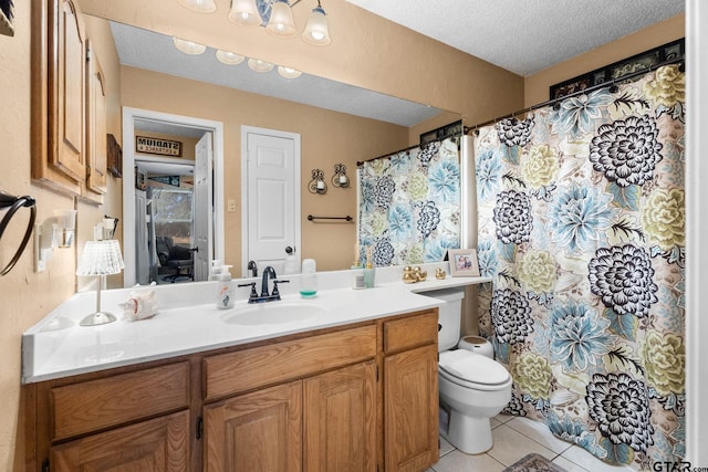 10769 Indigo Ln, Flint, TX 75762 - bathroom with vanity, tile patterned floors, a textured ceiling, and a shower with shower curtain