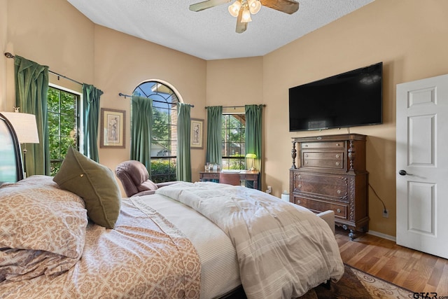 10769 Indigo Ln, Flint, TX 75762 - bedroom with wood finished floors, a textured ceiling, and ceiling fan