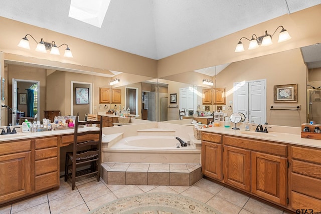 10769 Indigo Ln, Flint, TX 75762 - full bath featuring vaulted ceiling, a skylight, tile patterned floors, a garden tub, and vanity