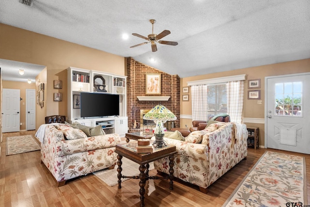 10769 Indigo Ln, Flint, TX 75762 - living room with a textured ceiling, ceiling fan, vaulted ceiling, and wood finished floors