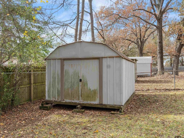 view of shed with a fenced backyard