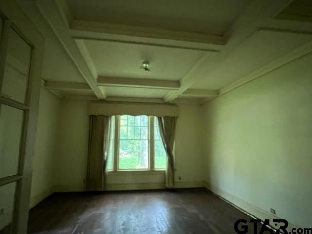 unfurnished room with dark wood-type flooring, beamed ceiling, and coffered ceiling