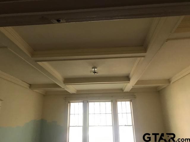 details featuring coffered ceiling and beam ceiling