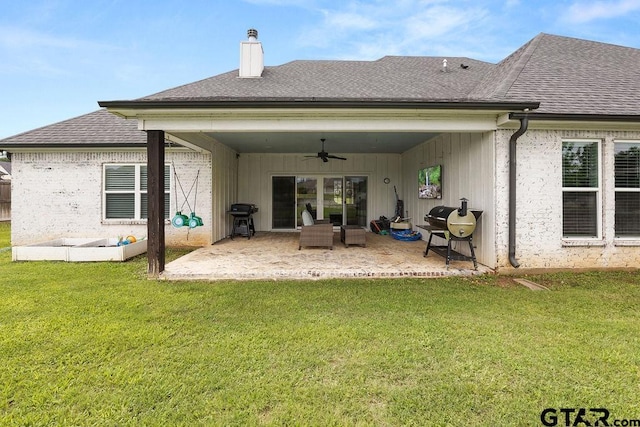 429 Coventry, Bullard, TX 75757 - back of house featuring ceiling fan, a chimney, a patio area, a yard, and a shingled roof