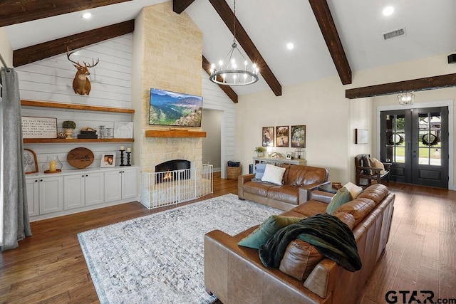 429 Coventry, Bullard, TX 75757 - living room featuring a chandelier, wood finished floors, beamed ceiling, a stone fireplace, and high vaulted ceiling
