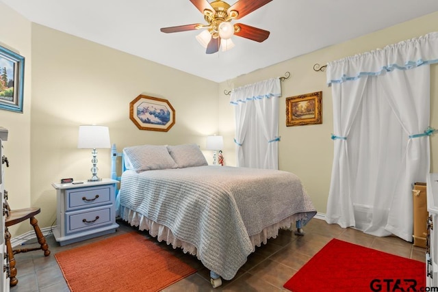 841 Pops Landing Rd, Ore City, TX 75683 - tiled bedroom with a ceiling fan and baseboards