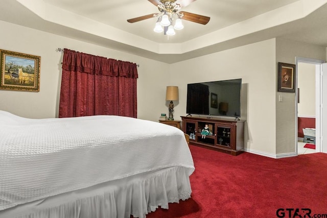 841 Pops Landing Rd, Ore City, TX 75683 - bedroom featuring carpet flooring, ceiling fan, and a tray ceiling