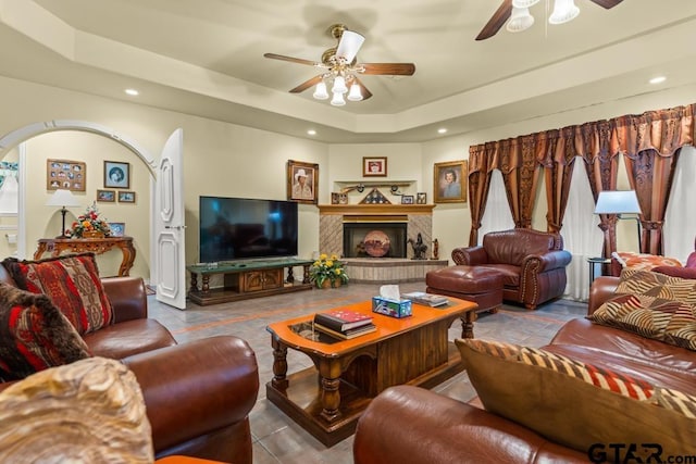 841 Pops Landing Rd, Ore City, TX 75683 - living area with ceiling fan, a tray ceiling, recessed lighting, and a brick fireplace