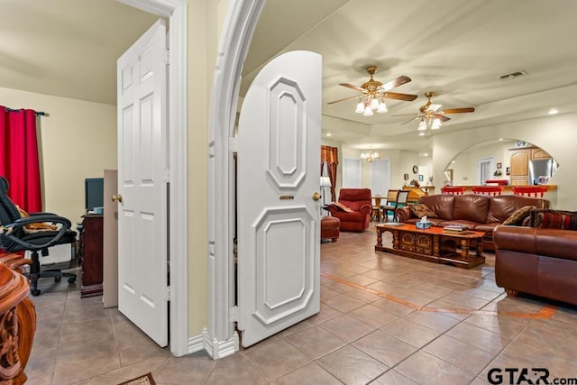 841 Pops Landing Rd, Ore City, TX 75683 - living room featuring light tile patterned floors, a ceiling fan, and arched walkways