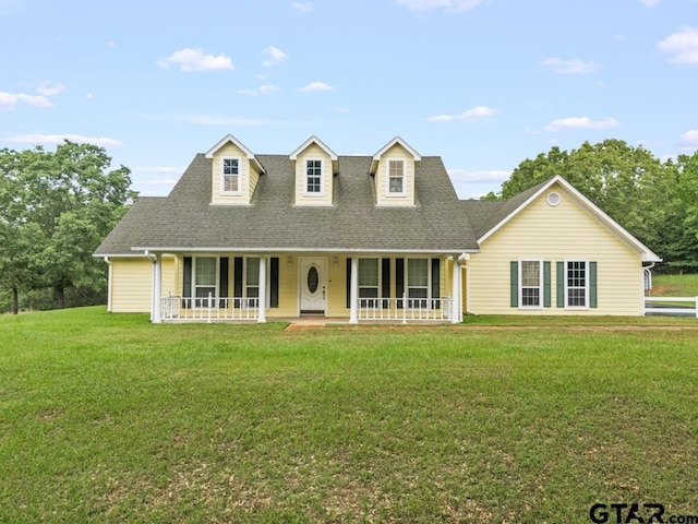 841 Pops Landing Rd, Ore City, TX 75683 - new england style home with a shingled roof, a front lawn, and a porch