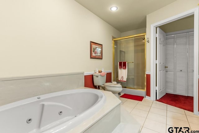 841 Pops Landing Rd, Ore City, TX 75683 - bathroom with a closet, a shower stall, a jetted tub, tile patterned floors, and recessed lighting