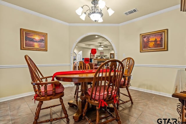841 Pops Landing Rd, Ore City, TX 75683 - dining area with arched walkways, ornamental molding, tile patterned flooring, and a ceiling fan