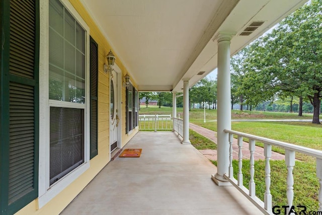 841 Pops Landing Rd, Ore City, TX 75683 - porch featuring a yard