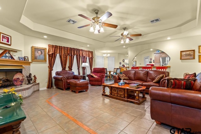 841 Pops Landing Rd, Ore City, TX 75683 - living room with a raised ceiling, light tile patterned floors, ceiling fan, recessed lighting, and arched walkways