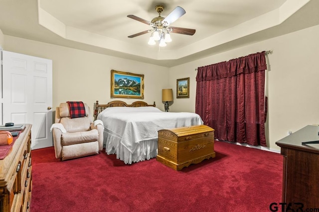 841 Pops Landing Rd, Ore City, TX 75683 - carpeted bedroom with a raised ceiling and a ceiling fan